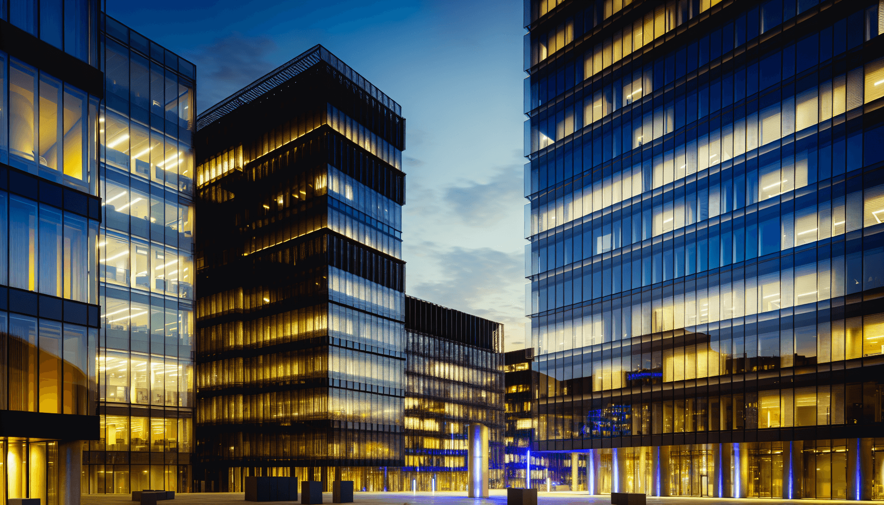 Contemporary European cityscape with modern office buildings and reflections of city lights.